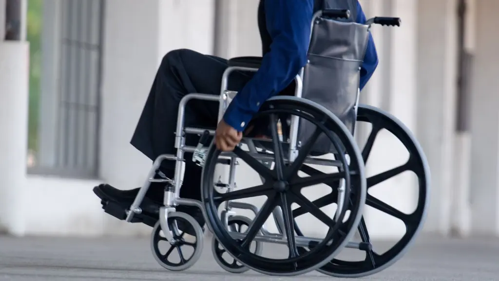 A person in a wheelchair. 