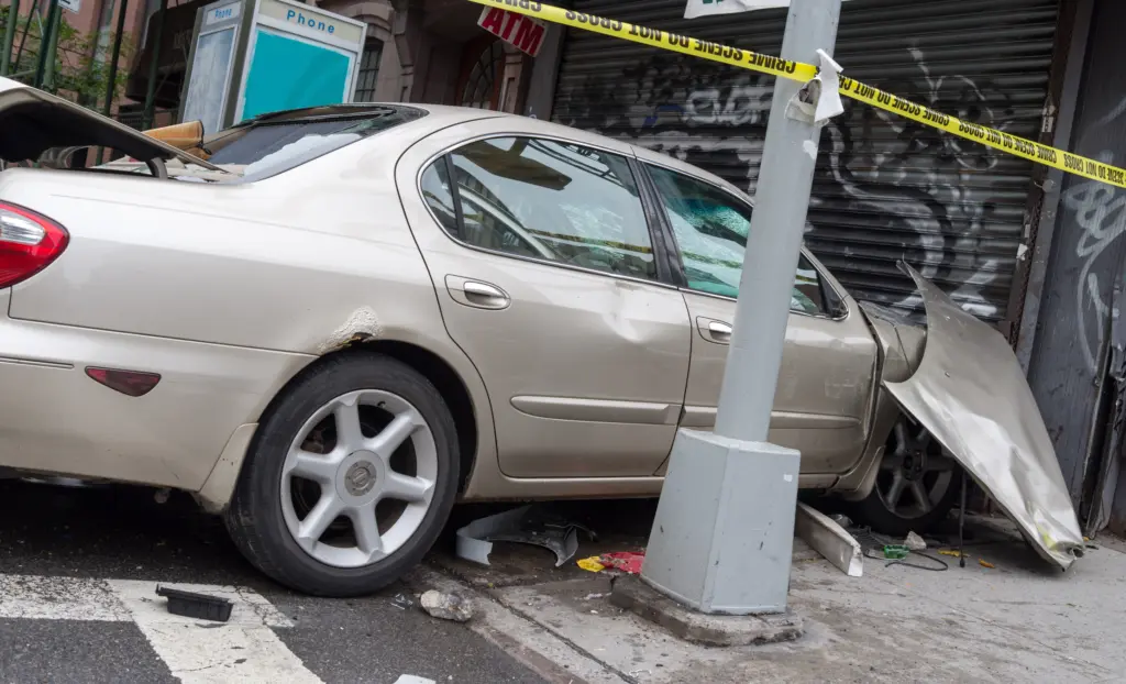 A car crashed into a building. 