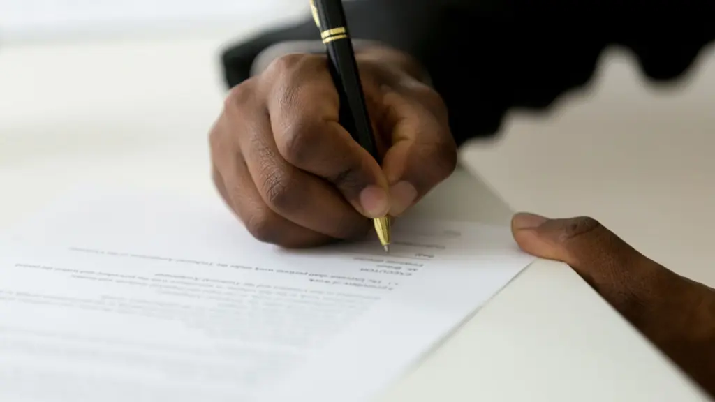 A man signing a contract.