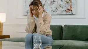 A sad woman trying to process what happened. 