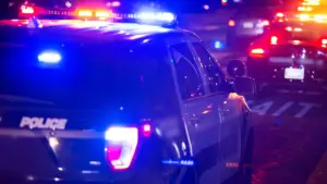 A police van pulling over a car.