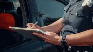 A police officer writing a report.