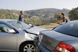 Two drivers arguing over a car accident. 